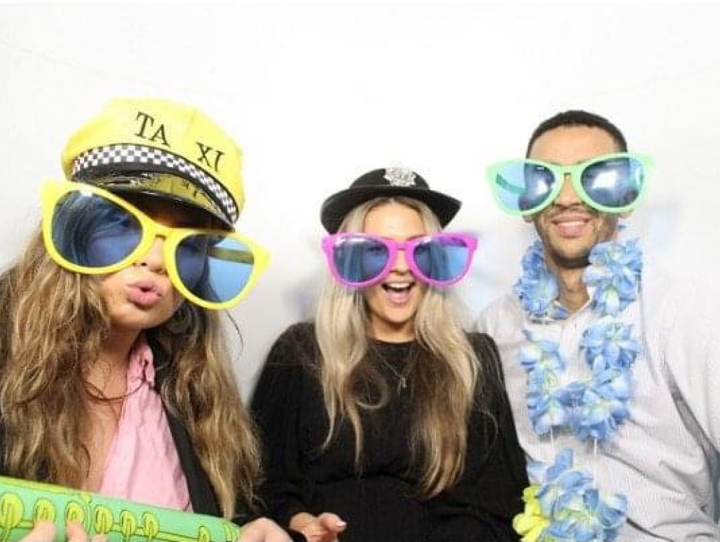 The team in a fun photobooth.